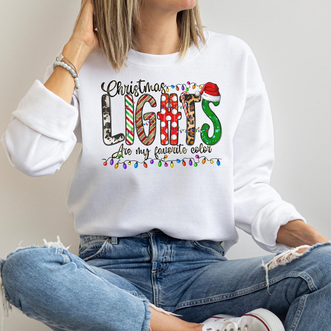 a woman wearing a christmas lights sweatshirt